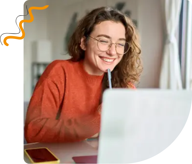 Smiling woman working on a laptop